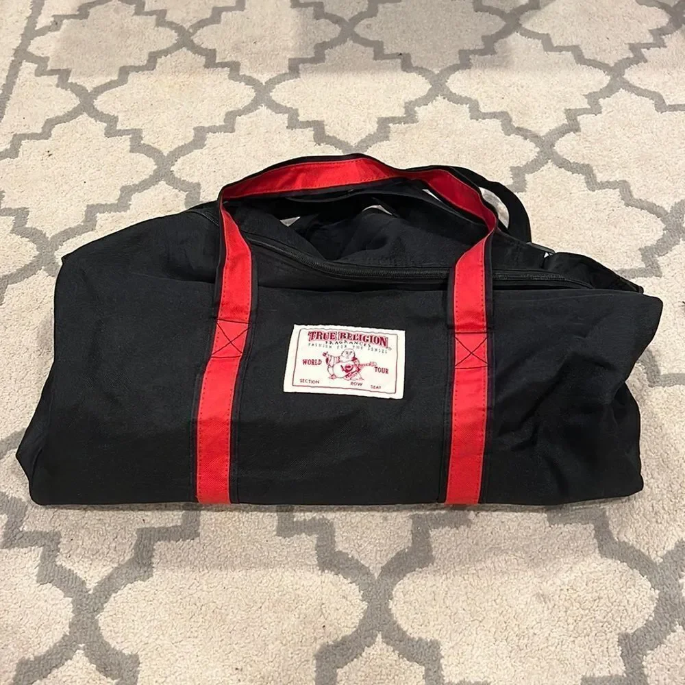 True Religion Black and Red Strap Duffel Bag